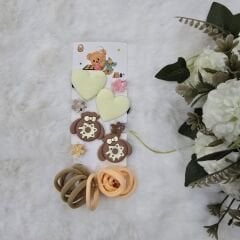 1 kart (10 adet lastik, 4adet klips, 4 adet kıskaç toka)